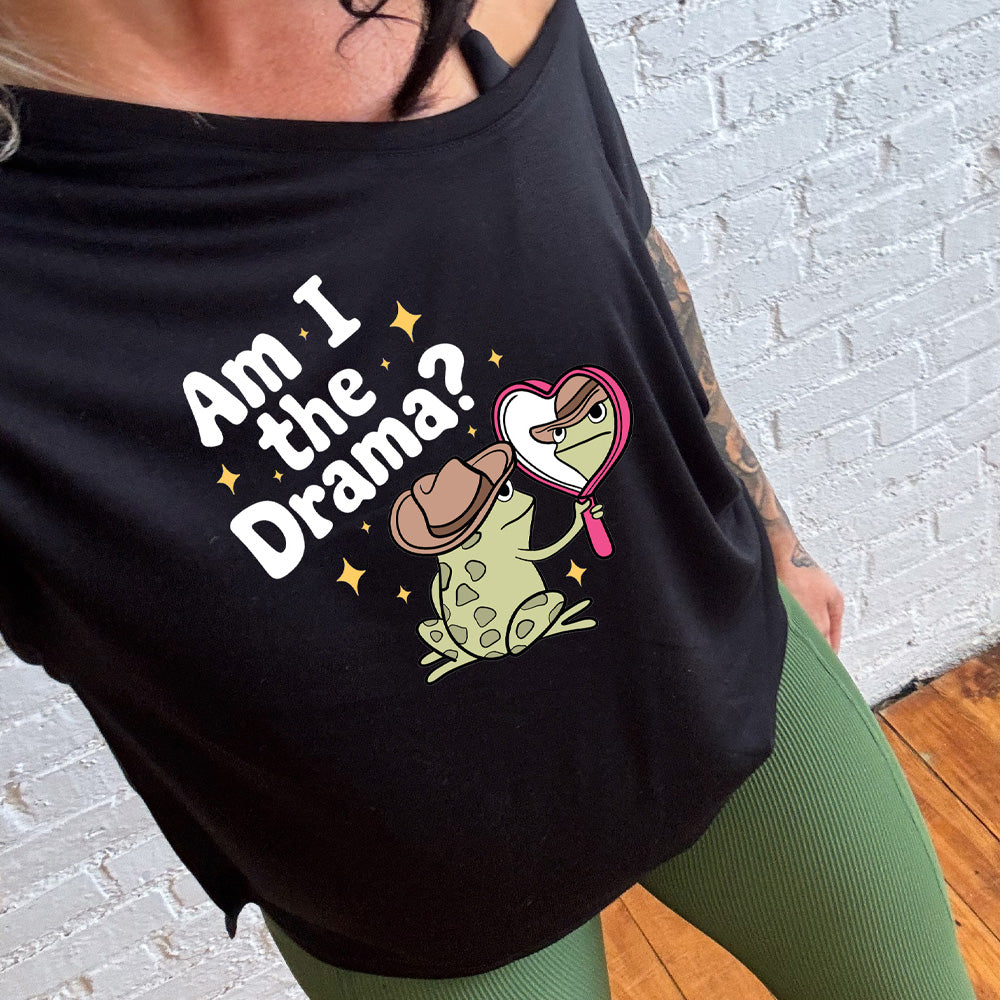 black slouchy shirt with the text "Am I The Drama" on it