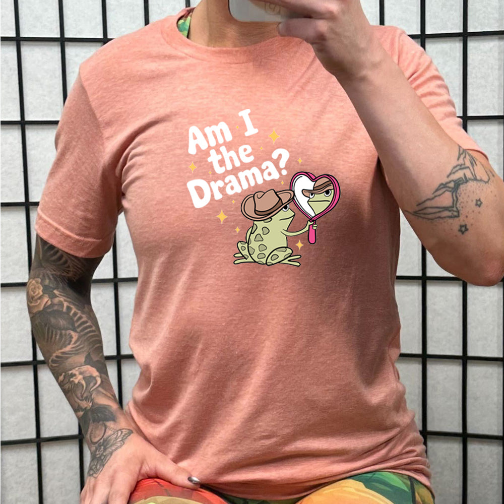 peach shirt with the text "Am I The Drama" on it