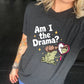 black shirt with the text "Am I The Drama" on it