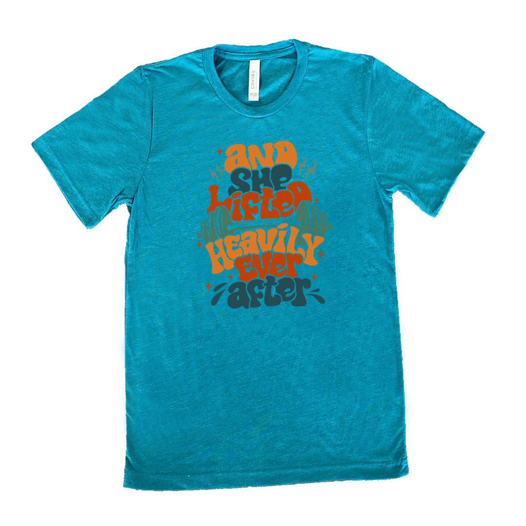 teal shirt with the text "And She Lifted Heavily Ever After" on it