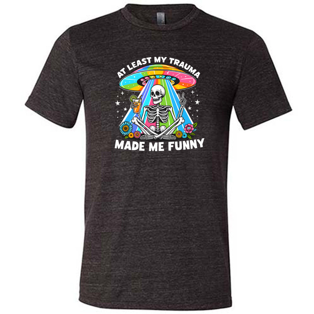 black shirt with the text "At Least My Trauma Made Me Funny" on it