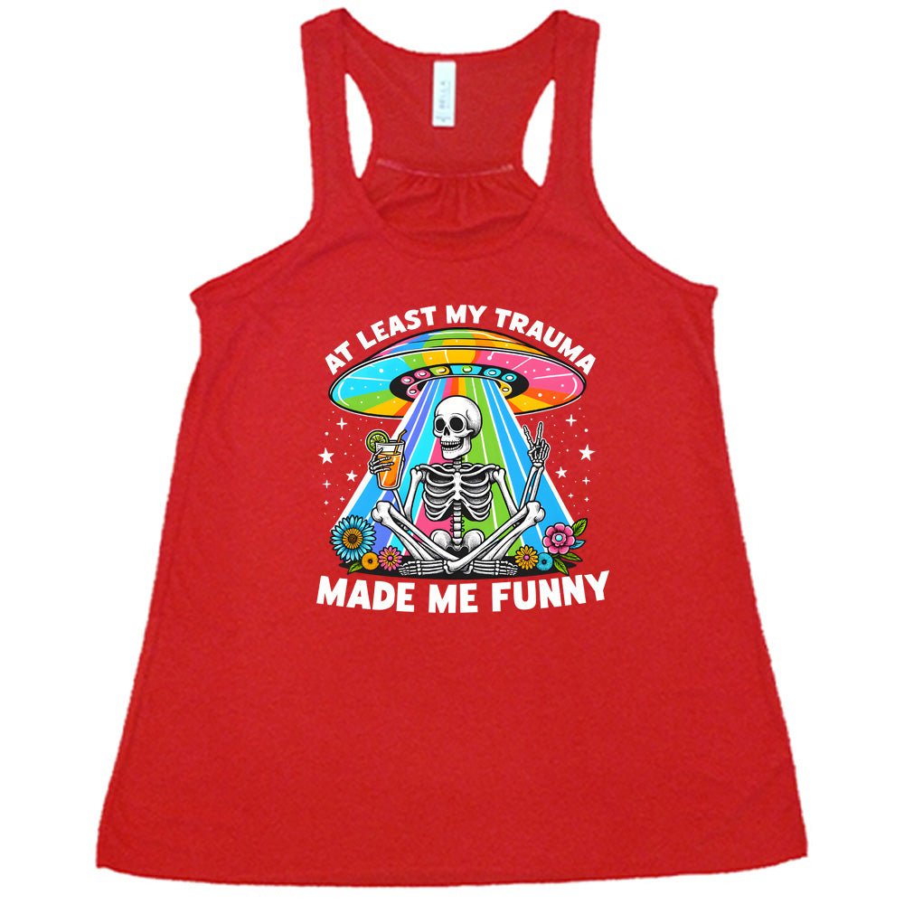 red shirt with the text "At Least My Trauma Made Me Funny" on it