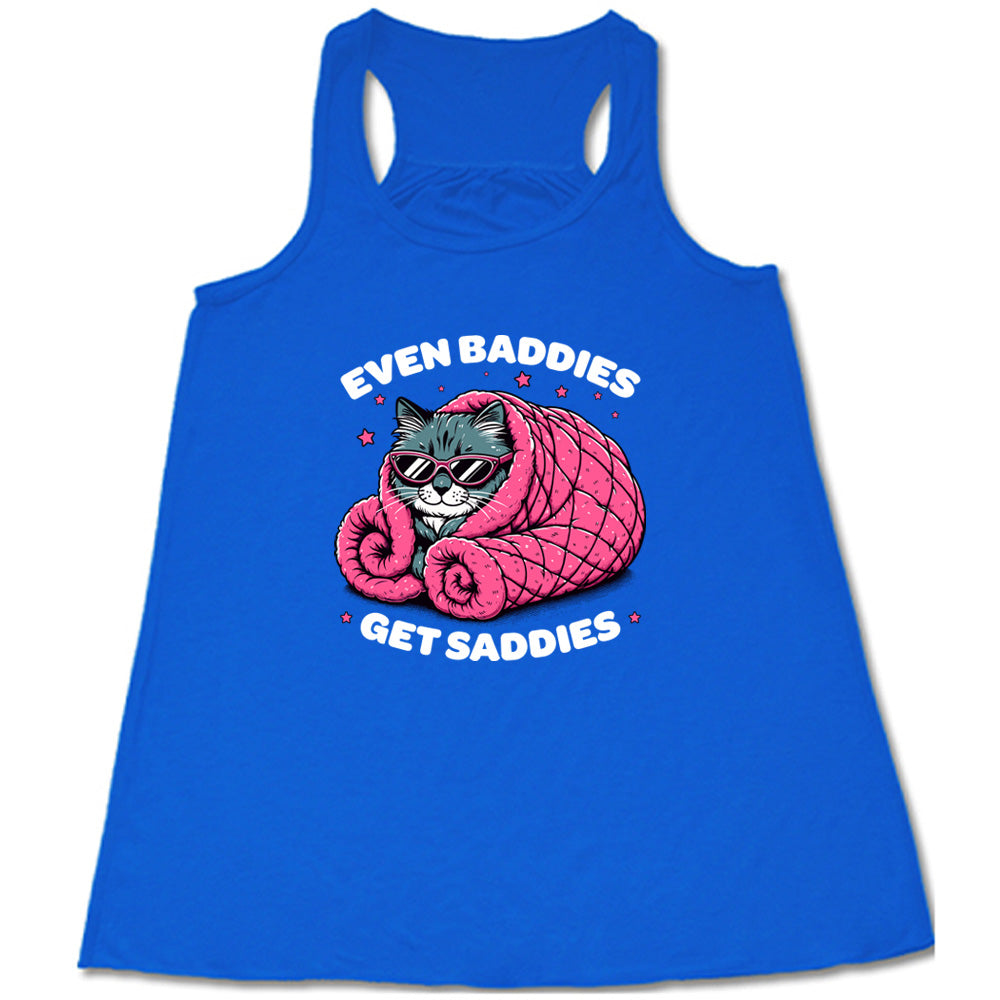 blue shirt with a cat graphic and the text "Even Baddies Get Saddies" on it