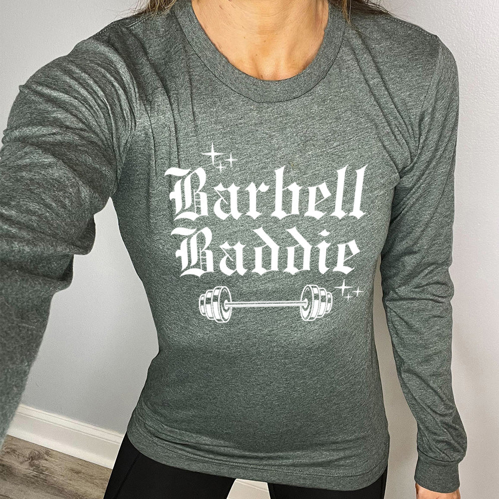 forest green long sleeve with the text "Barbell Baddie" on it