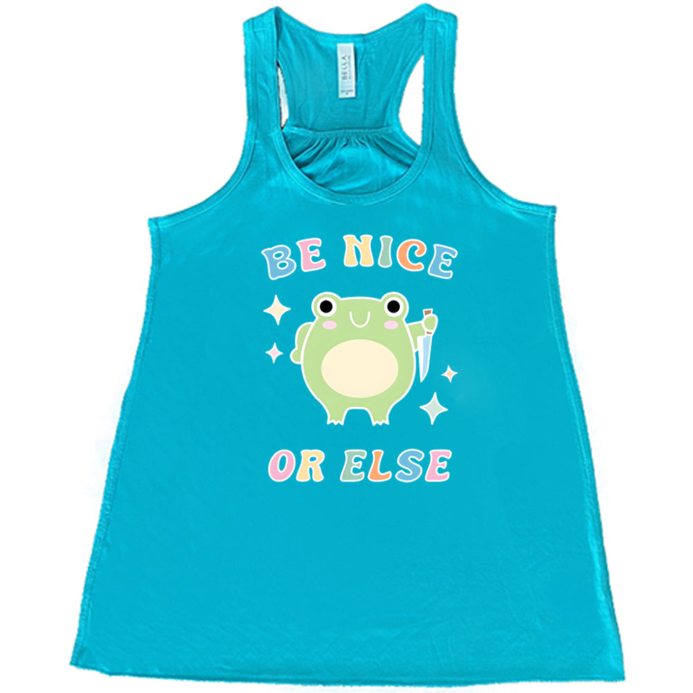 teal shirt with the text "Be Nice Or Else" on it