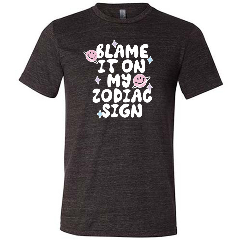 black shirt with the text "Blame It On My Zodiac Sign" on it