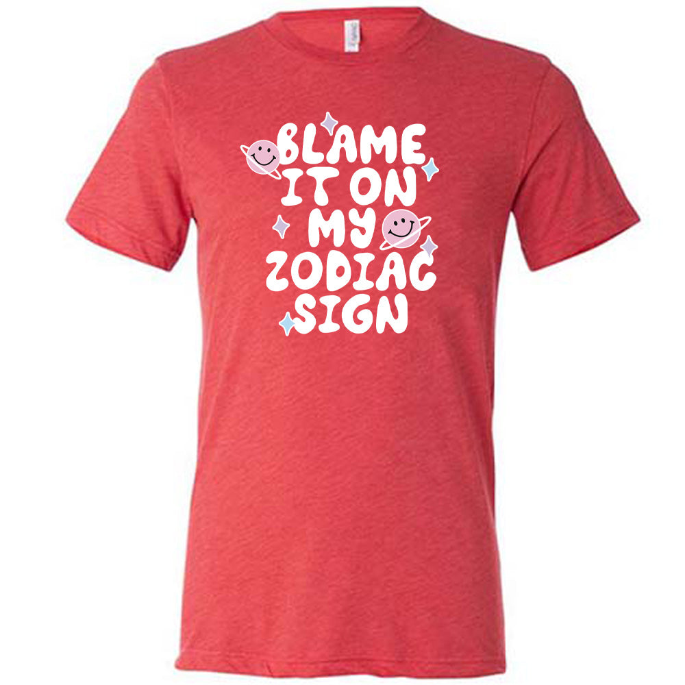 red shirt with the text "Blame It On My Zodiac Sign" on it