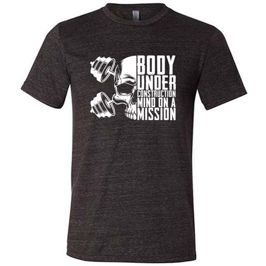 black shirt with the text "Body Under Construction, Mind on a Mission" on it