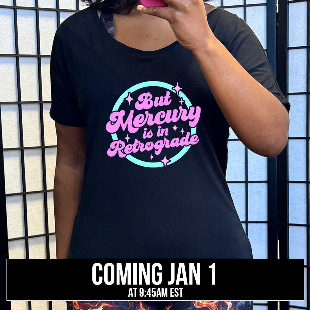 black slouchy shirt with the text "But Mercury Is In Retrograde" on it coming soon