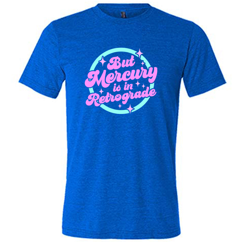 blue shirt with the text "But Mercury Is In Retrograde" on it