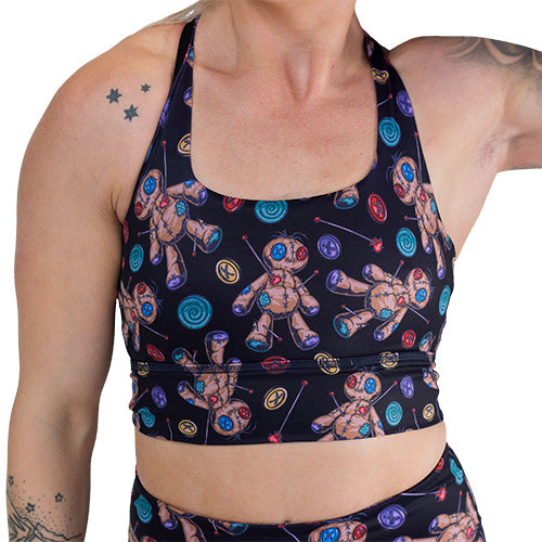 black voodoo doll patterned sports bra