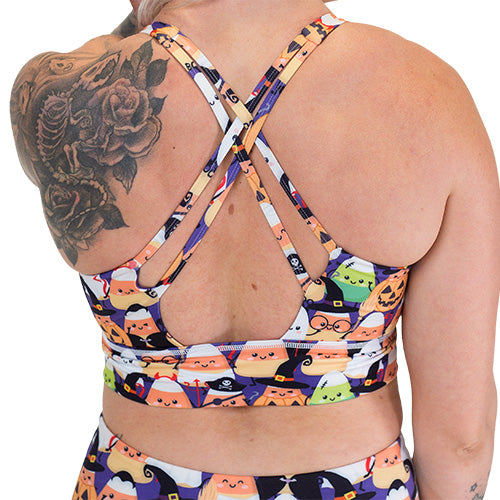 back of the halloween candy corn patterned sports bra