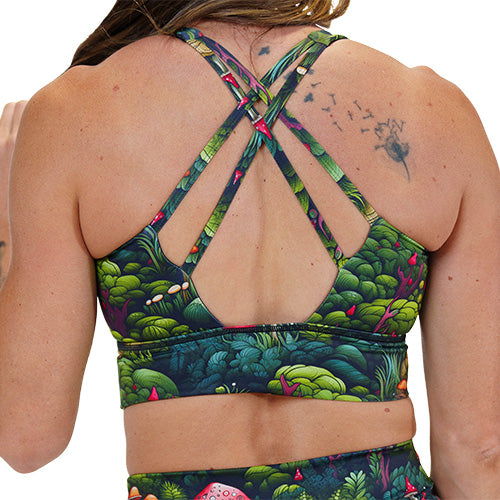 back of the enchanted forest themed sports bra