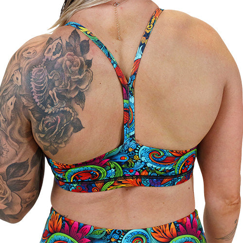 back of the floral swirl patterned sports bra