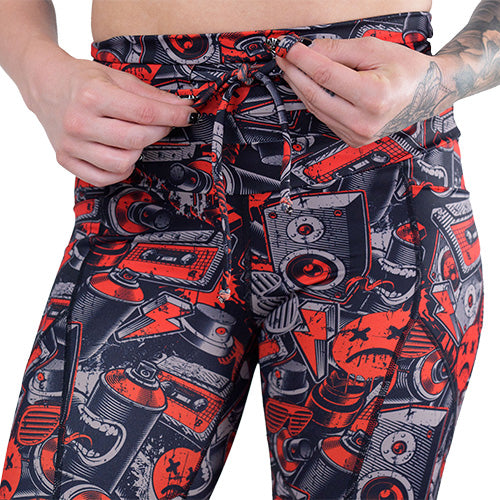 drawstring waistband on the graffiti patterned leggings