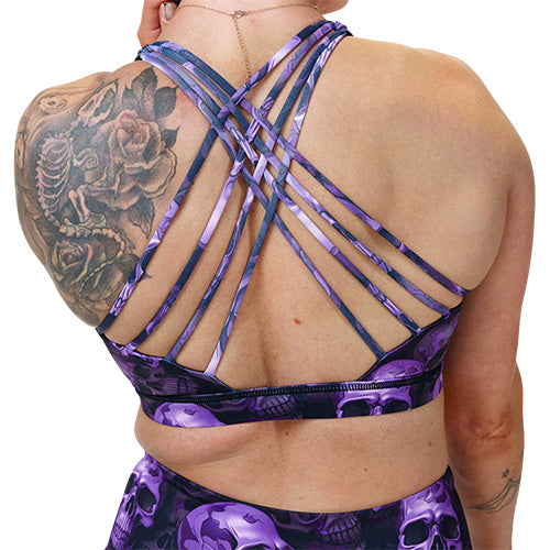 back of the purple skull patterned sports bra