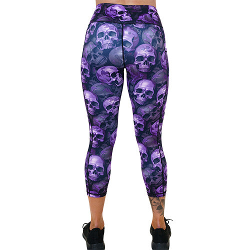 back of the capri length purple skull patterned leggings