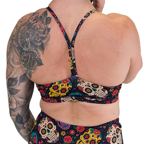 back of the sugar skull patterned sports bra