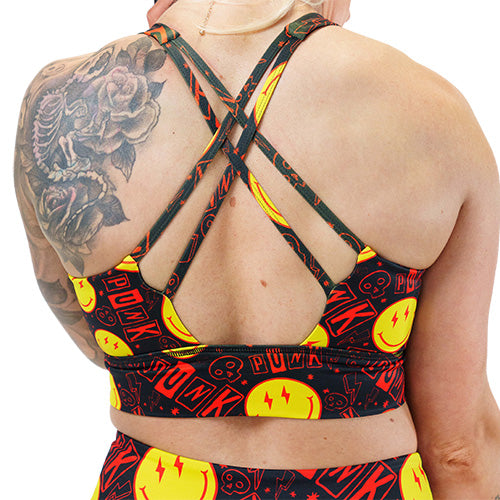 back of smiley face punk rock themed sports bra