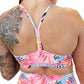 back of the bright colored palm tree leaf patterned sports bra