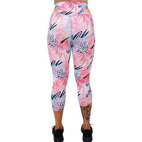 back of capri length bright colored palm tree leaf patterned leggings