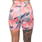 back of 7 inch bright colored palm tree leaf patterned shorts