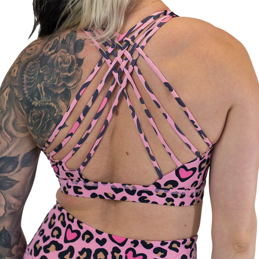 back of the pink heart and leopard patterned sports bra 