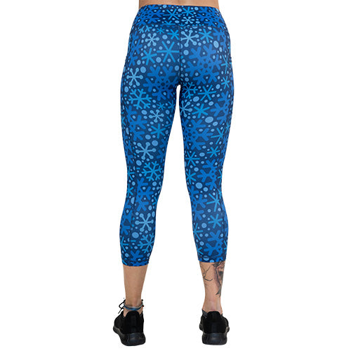 back of capri length blue snowflake patterned leggings