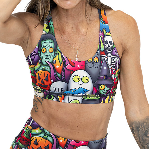 front of Halloween cartoons sports bra