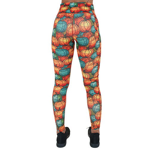 back of full length orange and blue mini pumpkin patterned leggings