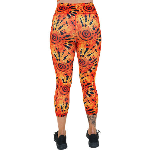 back of the capri length black and orange tie dye leggings