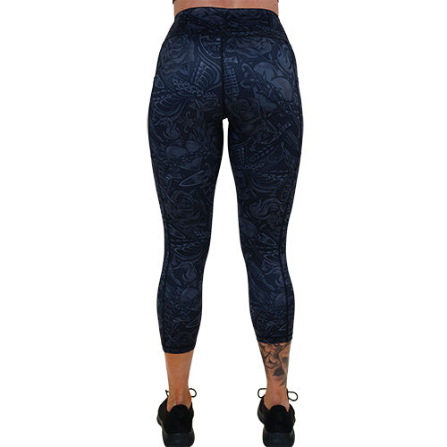 back of the capri length black and grey traditional tattoo design patterned leggings