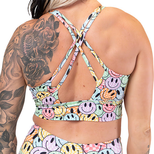 back of the smiley face patterned sports bra