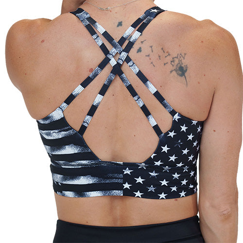 back of the black sports bra with white American flag design on it