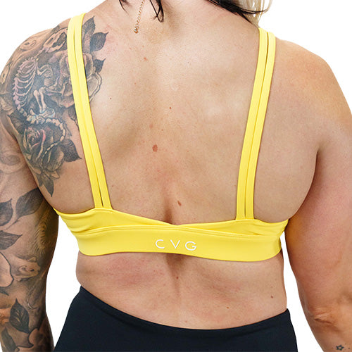 back of the solid yellow sports bra