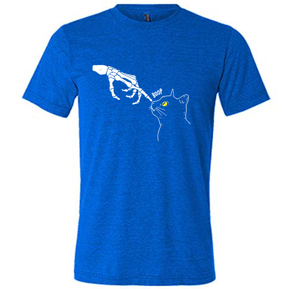 blue shirt with a skeleton hand tapping a cats nose graphic