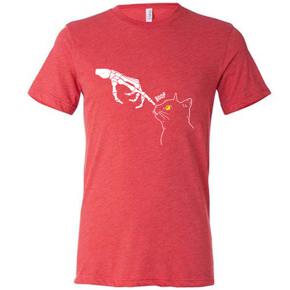 red shirt with a skeleton hand tapping a cats nose graphic