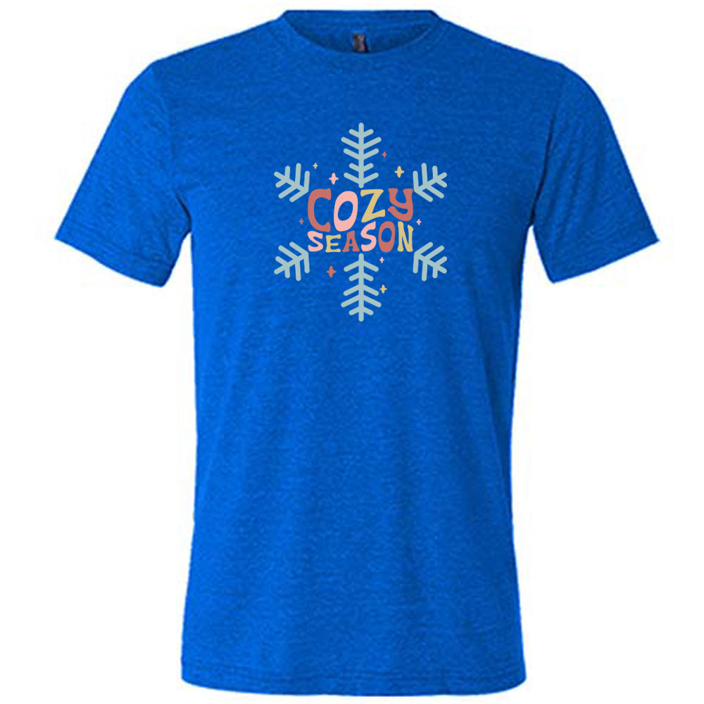 blue shirt with the text "cozy season" on it with a snowflake graphic