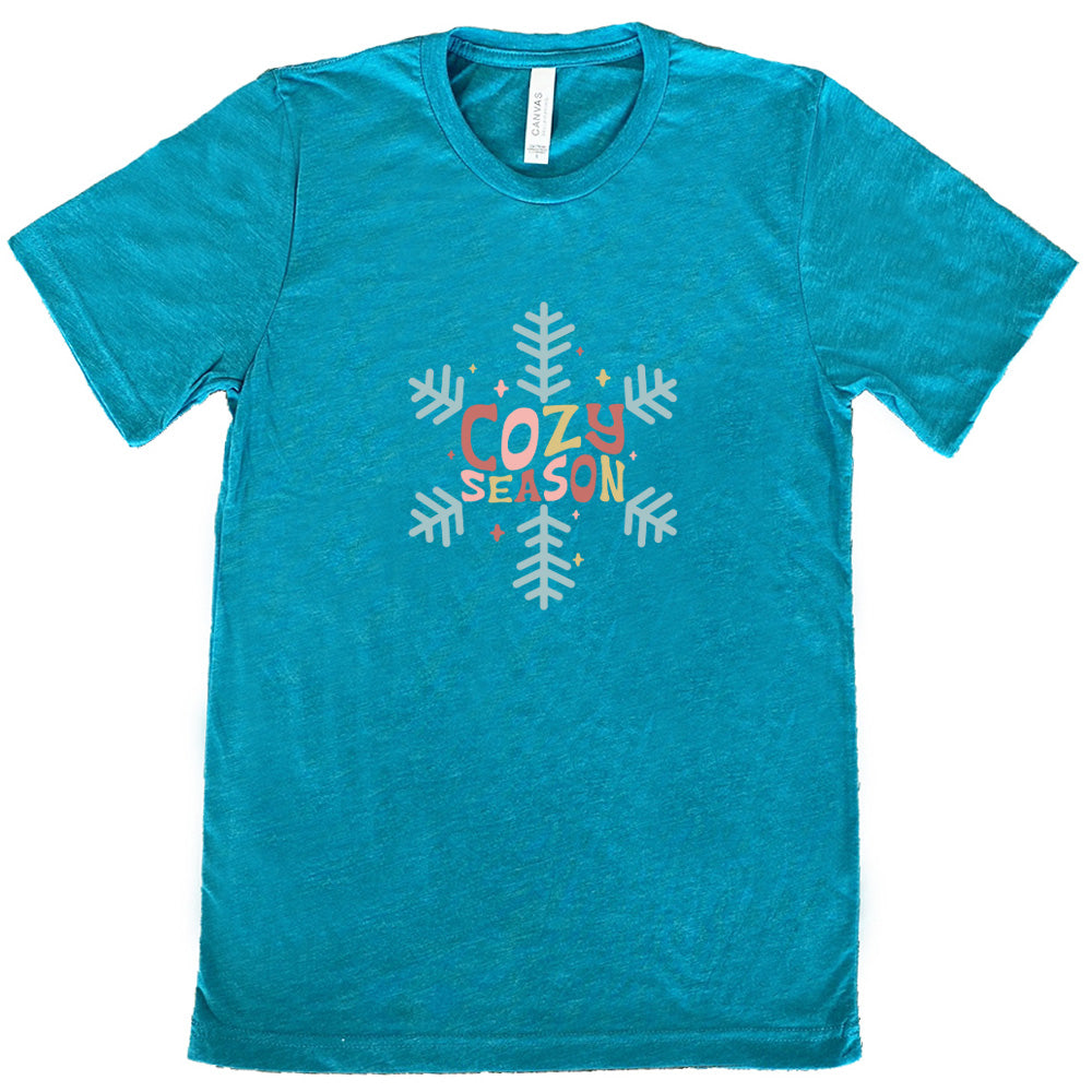 teal shirt with the text "cozy season" on it with a snowflake graphic