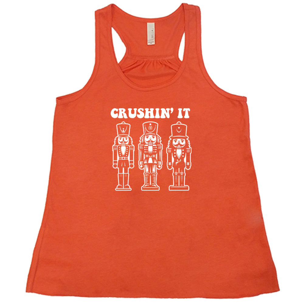 coral shirt with the text "Crushin' It" with nutcracker graphics on it