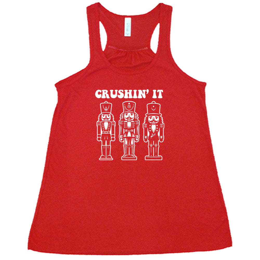 red shirt with the text "Crushin' It" with nutcracker graphics on it