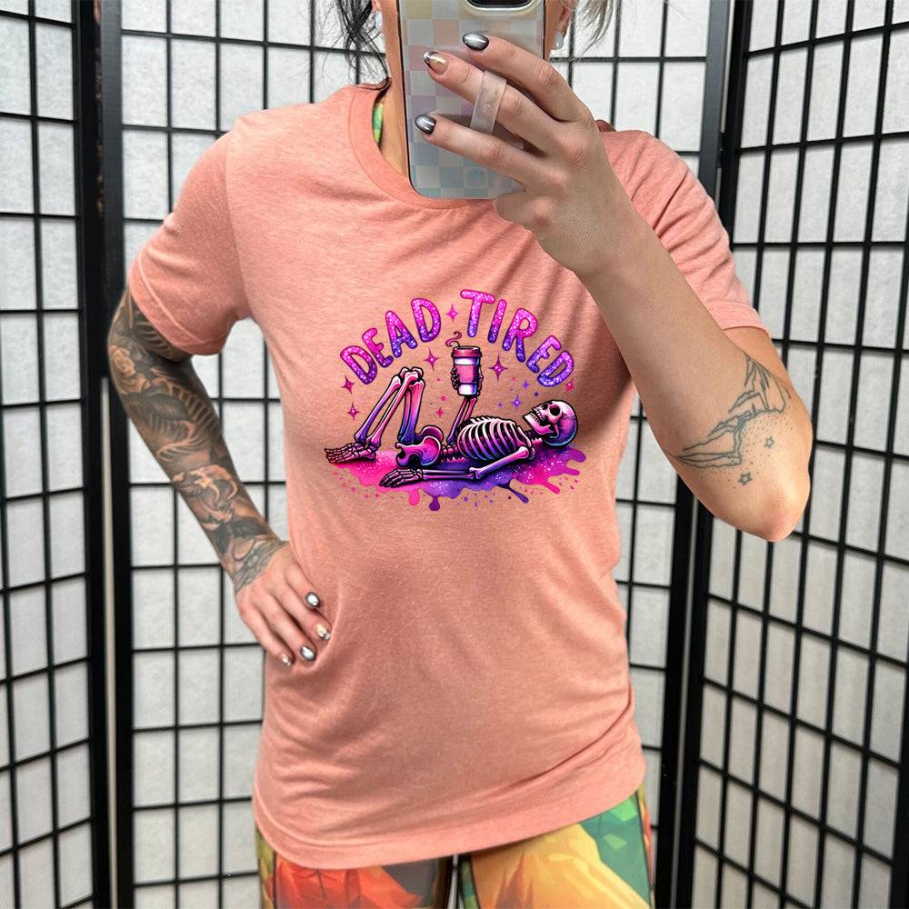 coral shirt with the text "Dead Tired" on it