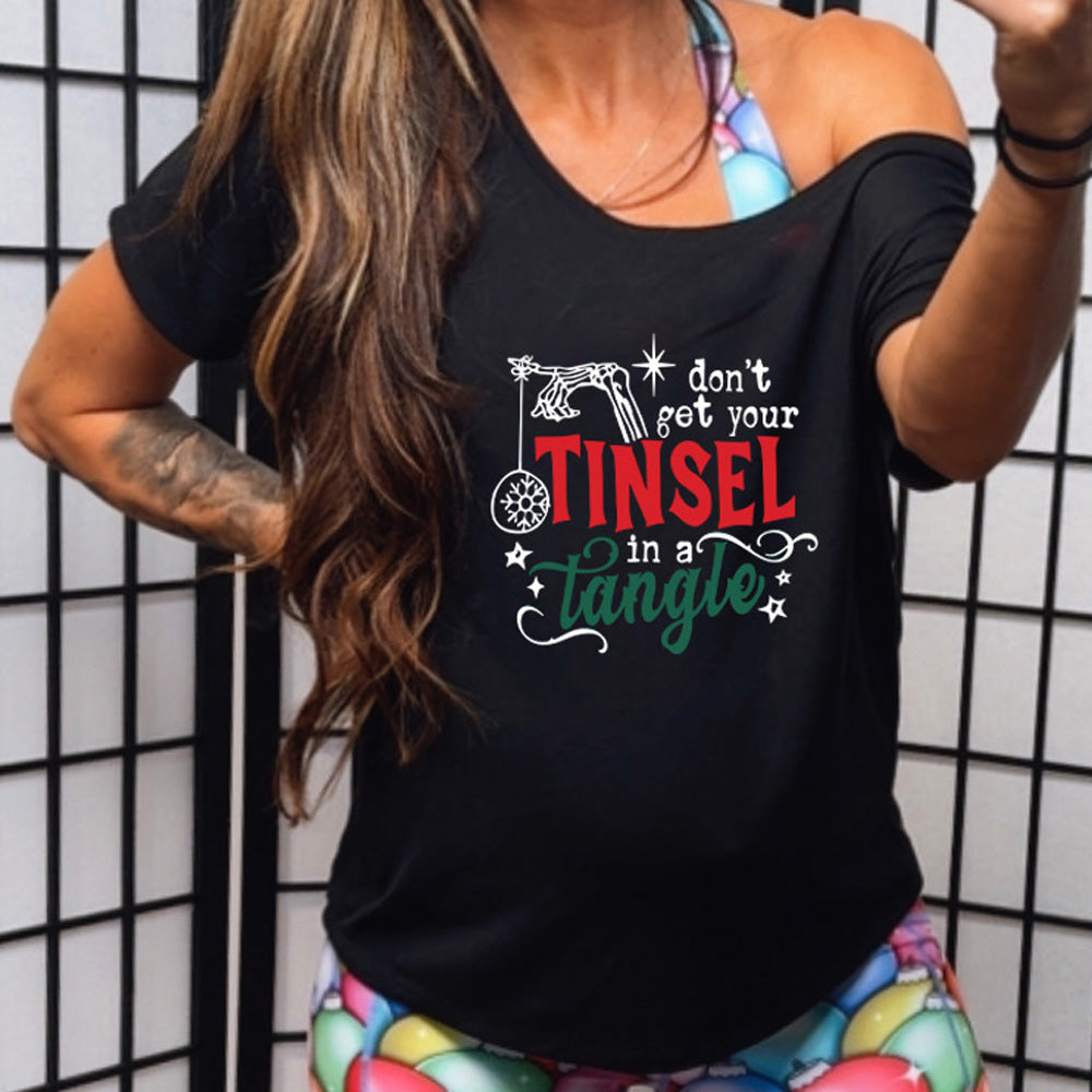 black slouchy shirt with the text "Don't Get Your Tinsel In A Tangle" on it 