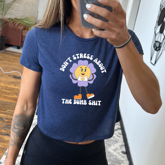 blue cropped tee with the text "Don't Stress About The Dumb Shit" on it