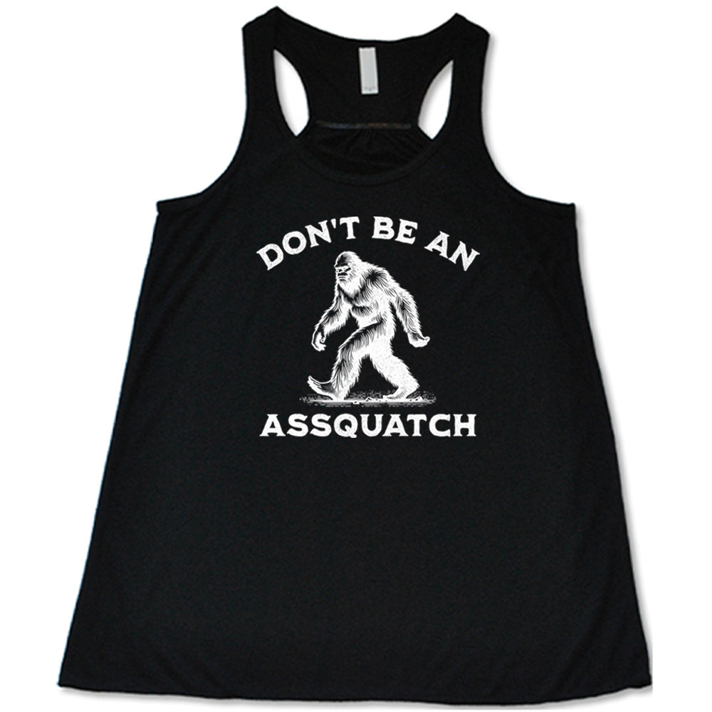 black shirt with the text "Don't Be An Assquatch" on it