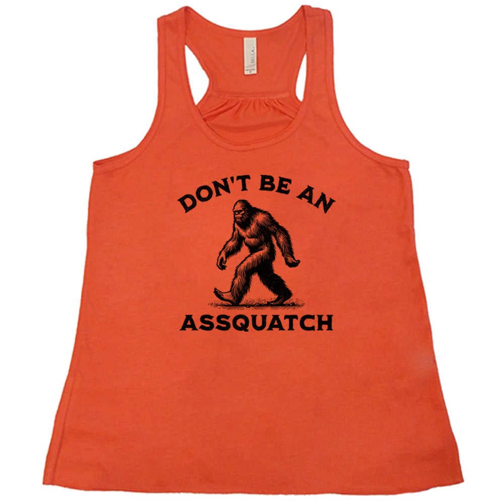 coral shirt with the text "Don't Be An Assquatch" on it