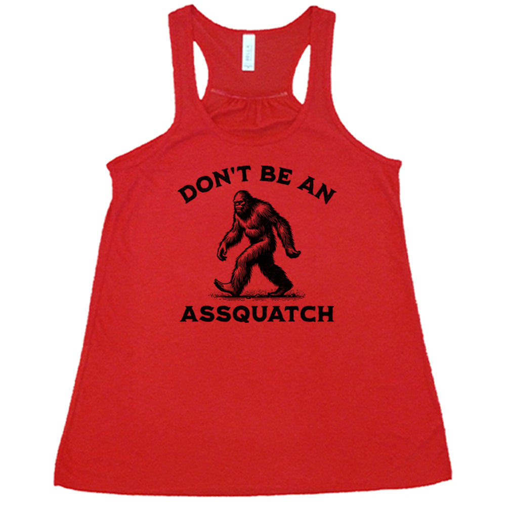 red shirt with the text "Don't Be An Assquatch" on it