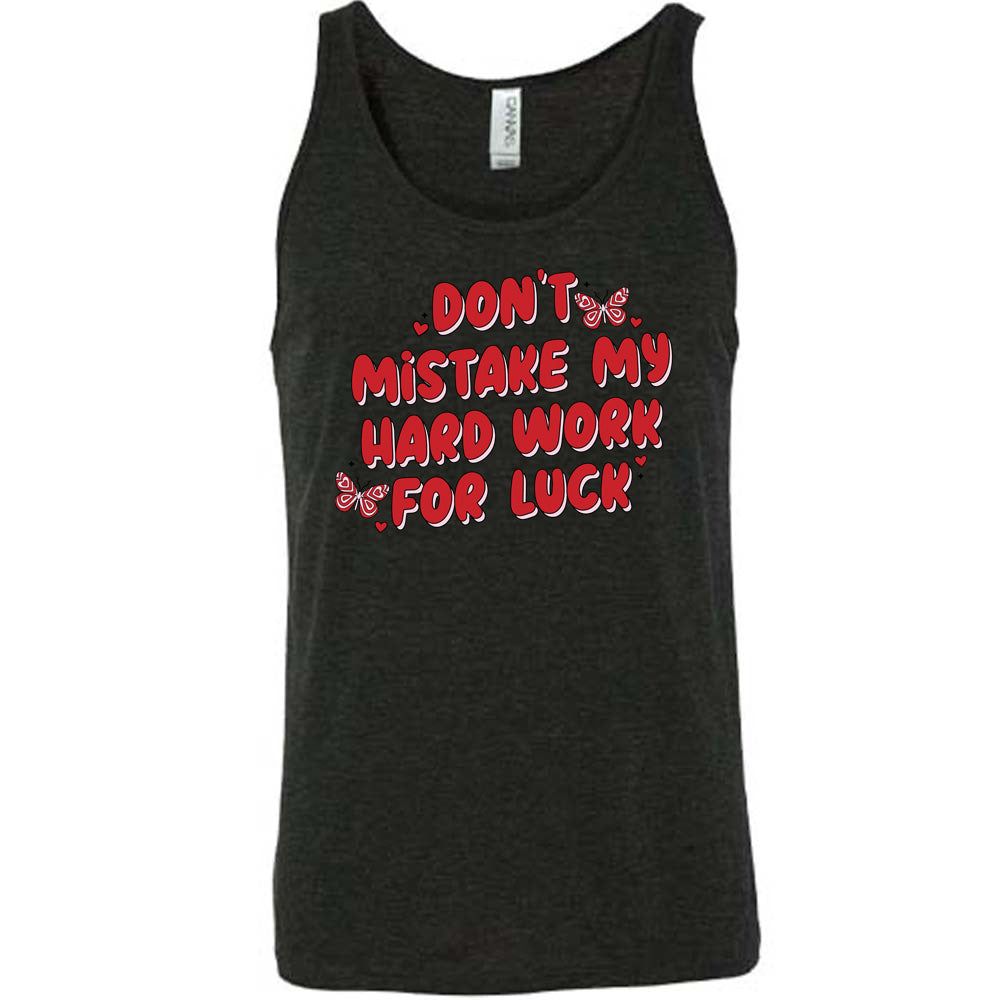 black unisex shirt with the text "Don't Mistake My Hard Work For Luck" on it