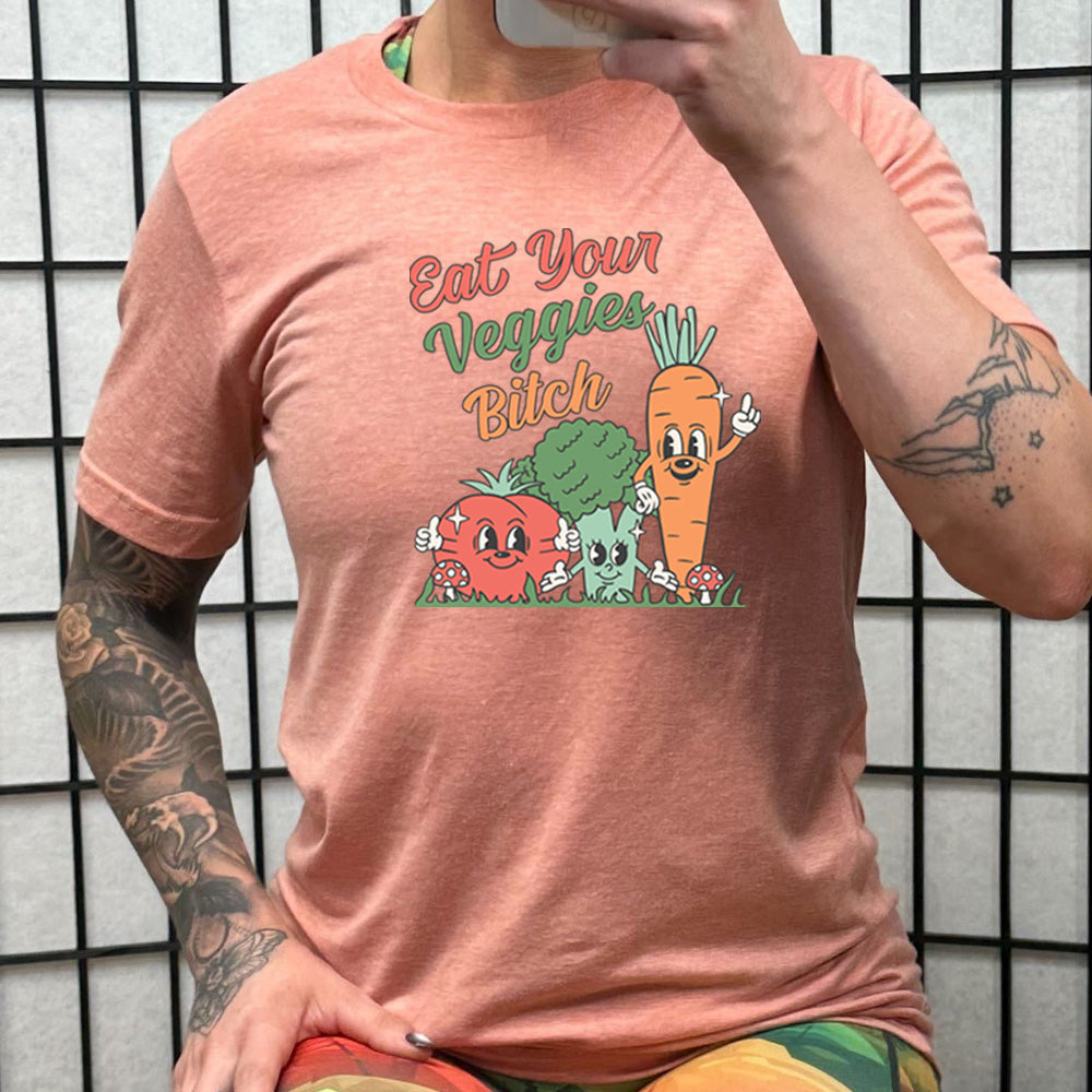 peach shirt with the text "Eat Your Veggies Bitch" on it