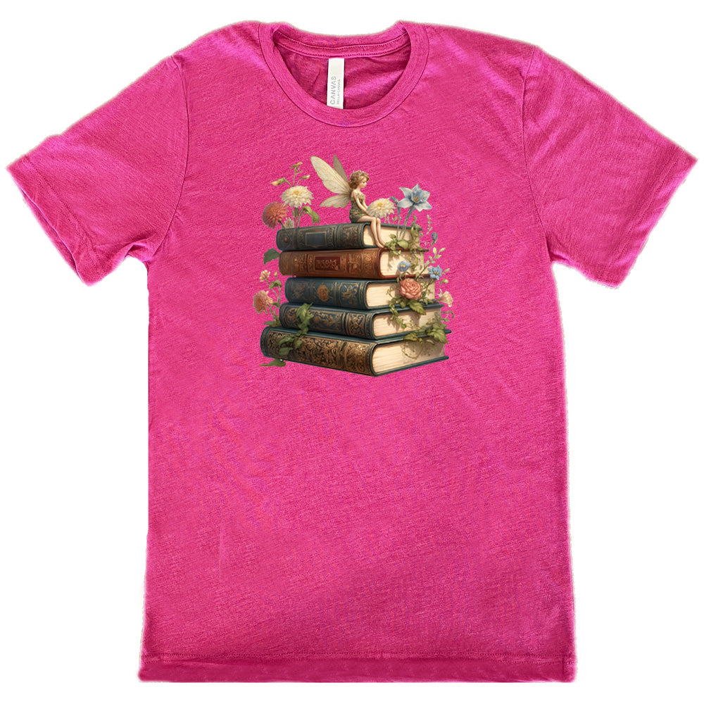 berry shirt with a fairy sitting on books graphic in the center